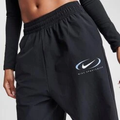 Women's Nike Sportswear Trend Swoosh Woven Jogger Pants Black - FN7700 010 12 Women's Nike Sportswear Trend Swoosh Woven Jogger Pants Black - FN7700 010 -Nike Store FN7700 010 M5