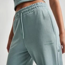 Women's FLETCHER X Supply & Demand Wide Flare Pants Chinois Green - SUW16467 610 -Nike Store SUW16467 610 M5